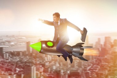 İş konseptinde roketle uçan erkek işadamı