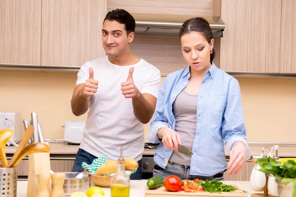 Young family in the kitchen — Stock Photo, Image