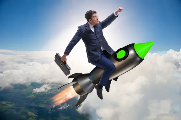 Male businessman flying on rocket in business concept — Stock Photo, Image