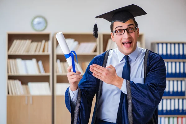 Young man graduating from university — Stock Photo, Image