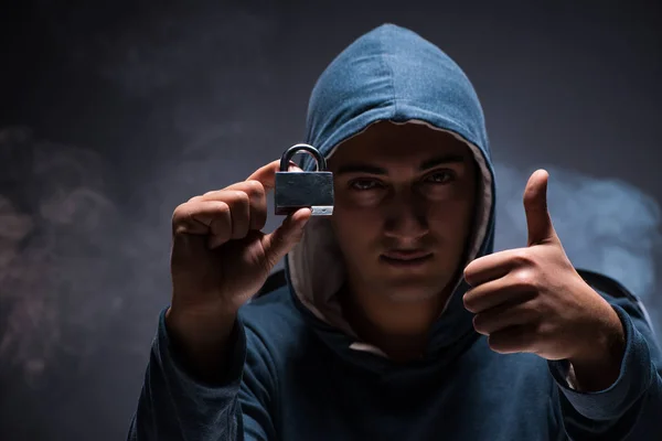 Computer hacker working in dark room — Stock Photo, Image