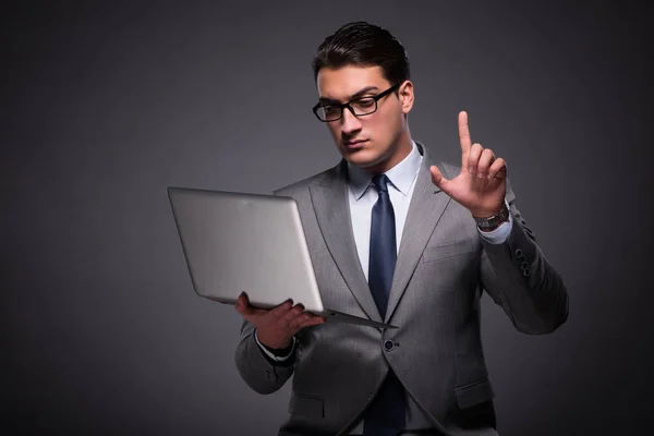 Handsome businessman working on laptop computer — Stock Photo, Image