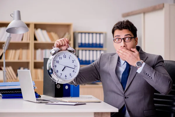 Businessman with clock failing to meet deadlines — Stock Photo, Image
