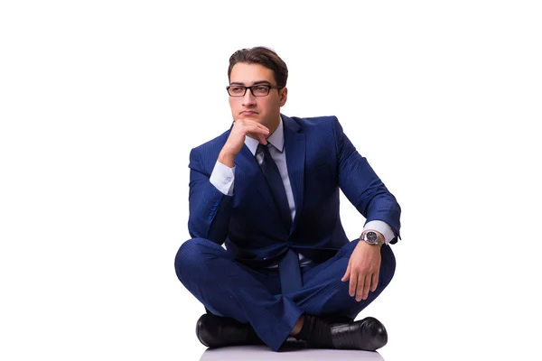 Businessman sitting on the floor isolated on white — Stock Photo, Image