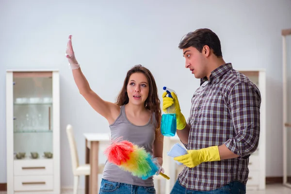 Wife and husband doing cleaning at home