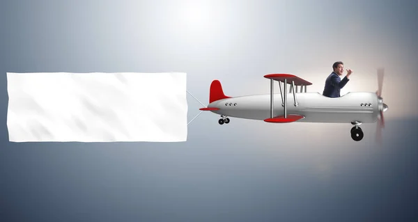 Biplane with businessman and blank banner — Stock Photo, Image