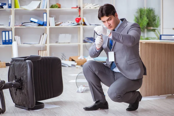 Young man during crime investigation in office — Stock Photo, Image