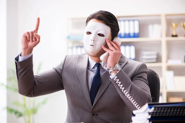 Businessman with mask in office hypocrisy concept — Stock Photo, Image