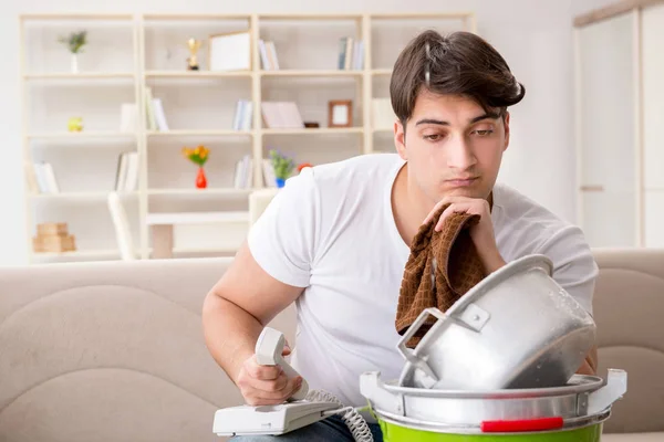 Man at home dealing with neighbor flood leak — Stock Photo, Image