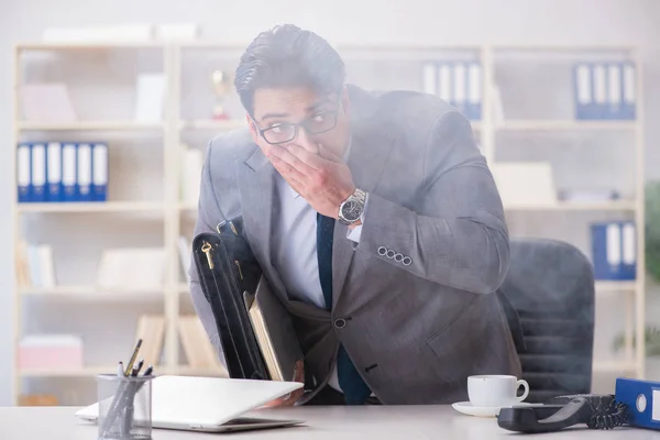 Businessman during fire alarm in office — Stock Photo, Image