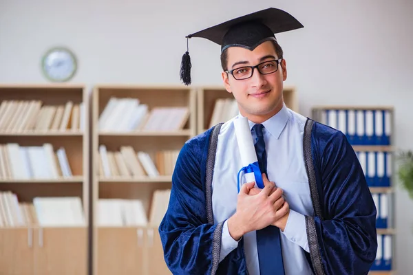 Young man graduating from university — Stock Photo, Image