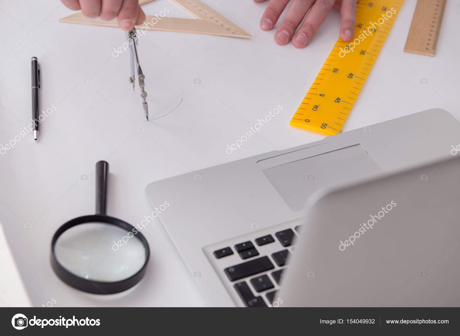 Male engineer working on drawings and blueprints — Stock Photo © Elnur