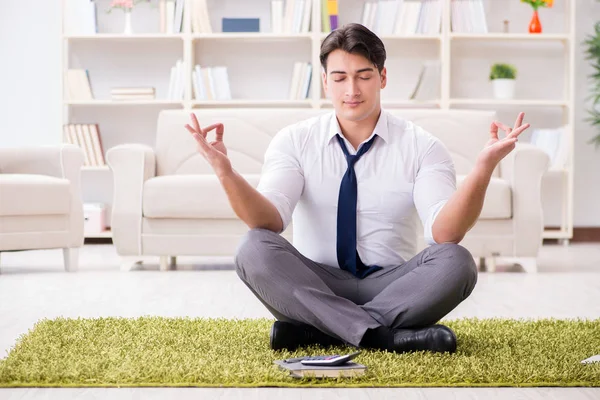 Businessman sitting on the floor in office — Stock Photo, Image