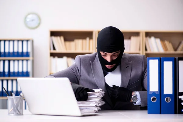 Criminal businessman wearing balaclava in office — Stock Photo, Image