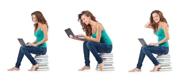 Student with netbook sitting on books — Stock Photo, Image