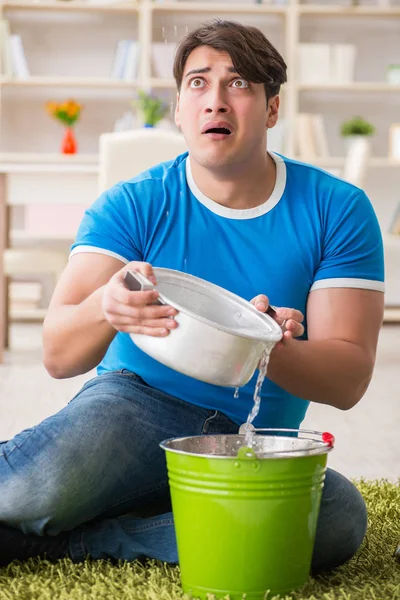 Man at home dealing with neighbor flood leak — Stock Photo, Image