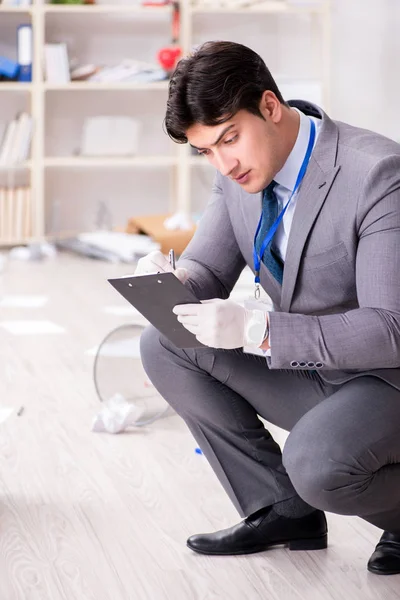 Young man during crime investigation in office — Stock Photo, Image