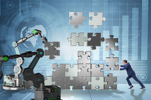 ロボット アームとジグソー パズルをしている実業家 — ストック写真
