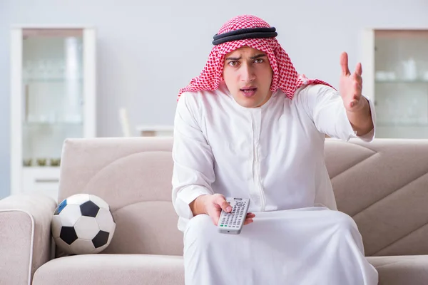 Arab man watching sport football at tv — Stock Photo, Image