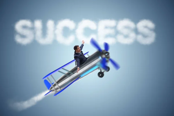 Businessman flying on airplane in success concept — Stock Photo, Image