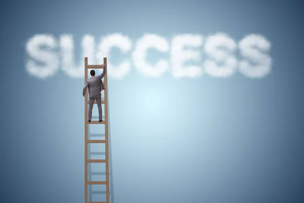 Businessman reaching success with career ladder — Stock Photo, Image