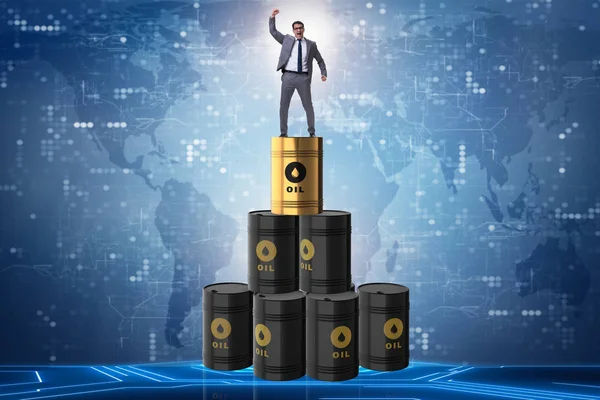 Businessman on top of oil barrels — Stock Photo, Image