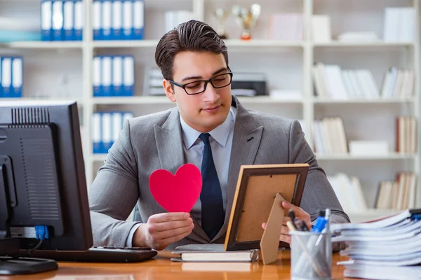 Businessman feeling love and loved in the office