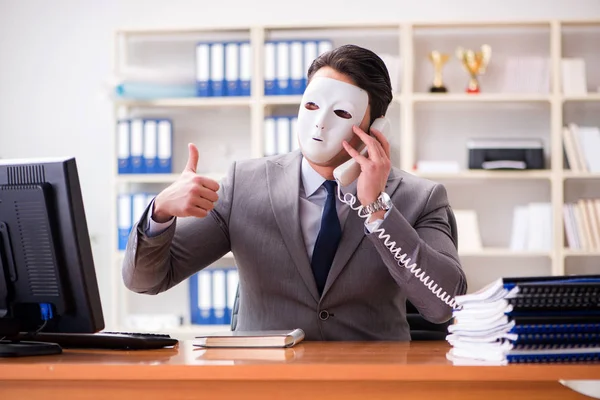 Businessman with mask in office hypocrisy concept — Stock Photo, Image