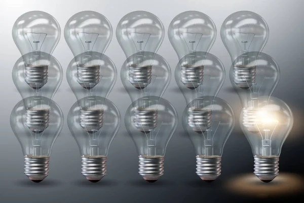 Standing our from the crown concept with light bulbs — Stock Photo, Image