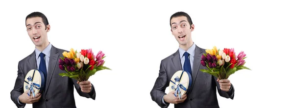 Zakenman met geschenkdoos en bloemen — Stockfoto