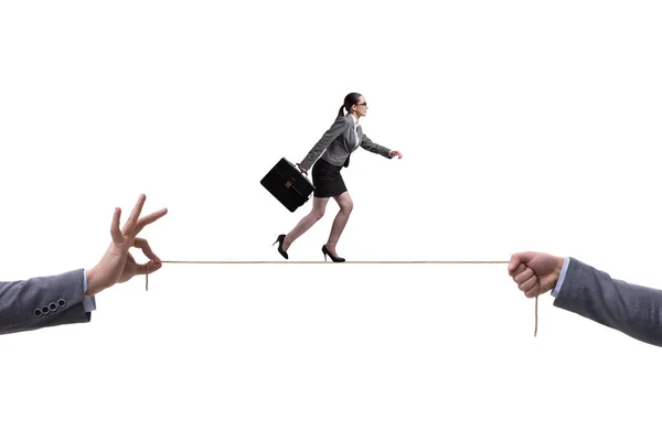 Businesswoman walking on tight rope in business concept — Stock Photo, Image