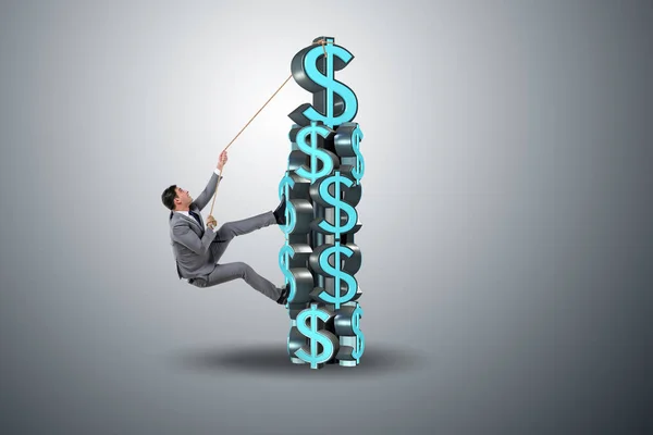Бизнесмен взбирается на башню вызова доллара — стоковое фото