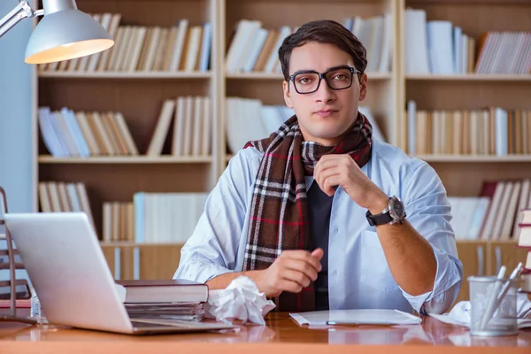 Young book writer writing in library