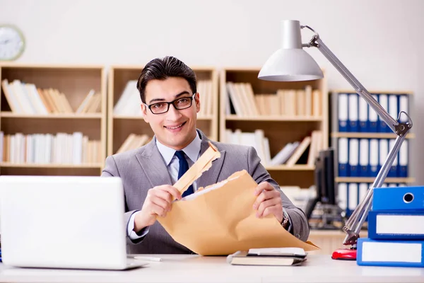 Businessman receiving letter envelope in office