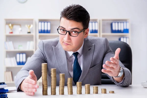 Businessman with golden coins in business growth concept — Stock Photo, Image