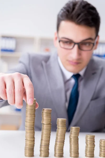 Businessman with golden coins in business growth concept — Stock Photo, Image