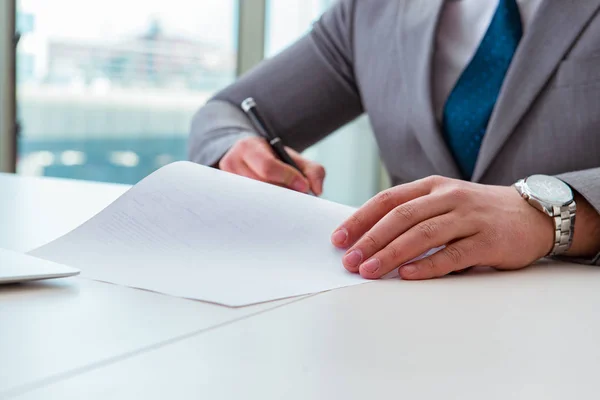 Businessman taking notes at the meeting — Stock Photo, Image