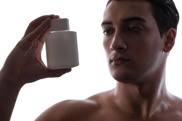 Homme sexy avec bouteille de parfum en photo discrète — Photo