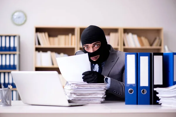 Criminal businessman wearing balaclava in office — Stock Photo, Image