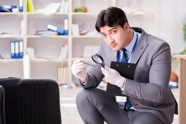 Young man during crime investigation in office — Stock Photo, Image
