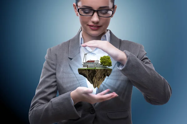 Geschäftsfrau hält fliegende Insel im Öko-Konzept — Stockfoto