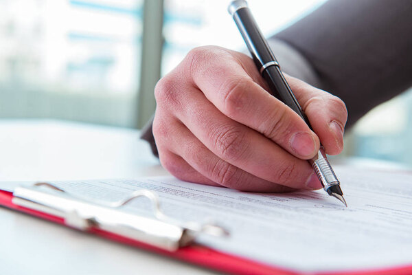 Businessman taking notes at the meeting