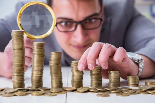 Businessman with golden coins in business growth concept — Stock Photo, Image