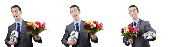 Empresario con caja de regalo y flores — Foto de Stock