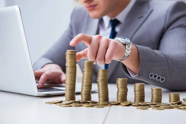 Businessman with golden coins in business growth concept — Stock Photo, Image