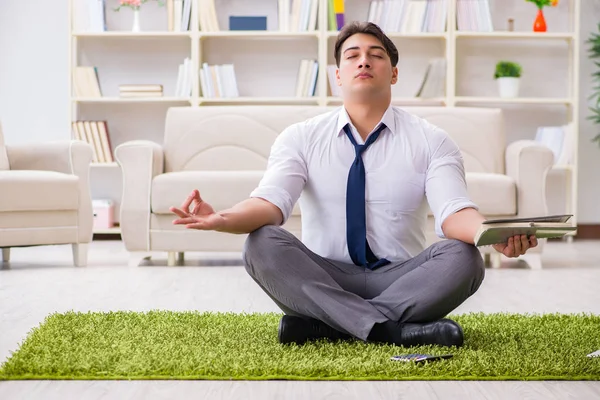 Businessman sitting on the floor in office — Stock Photo, Image