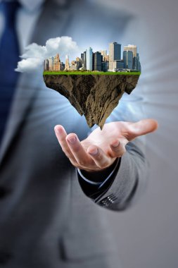 Fütüristik şehir planı tutan mimar