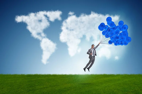 Biznesmen latające balony w jasny dzień — Zdjęcie stockowe
