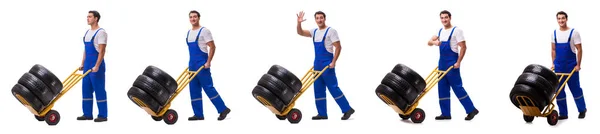 Tyre repairman with trolley isolated on white — Stock Photo, Image