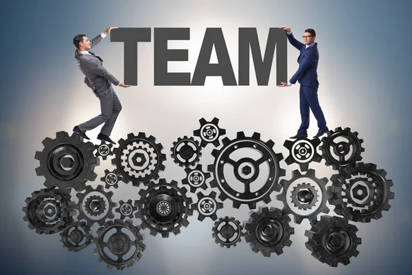 チームワークの概念で word のチームを保持しているビジネスマン — ストック写真